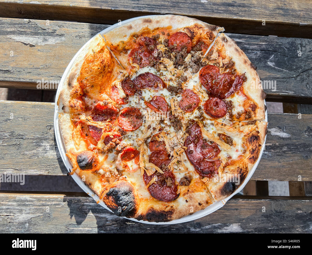 Meat feast with pepperoni chorizo and chicken pizza - Smartphone Captured Stock Image