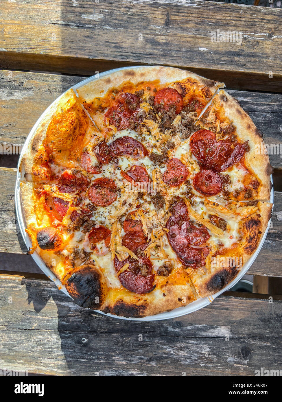 Meat feast with pepperoni chorizo and chicken pizza - Smartphone Captured Stock Image