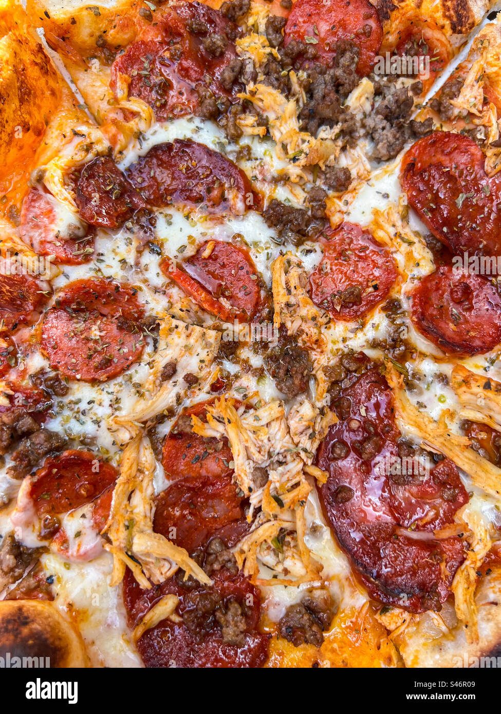 Meat feast with pepperoni chorizo and chicken pizza - Smartphone Captured Stock Image