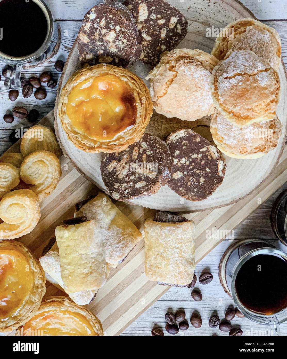 A selection of Portuguese pastries & black coffee - Smartphone Captured Stock Image