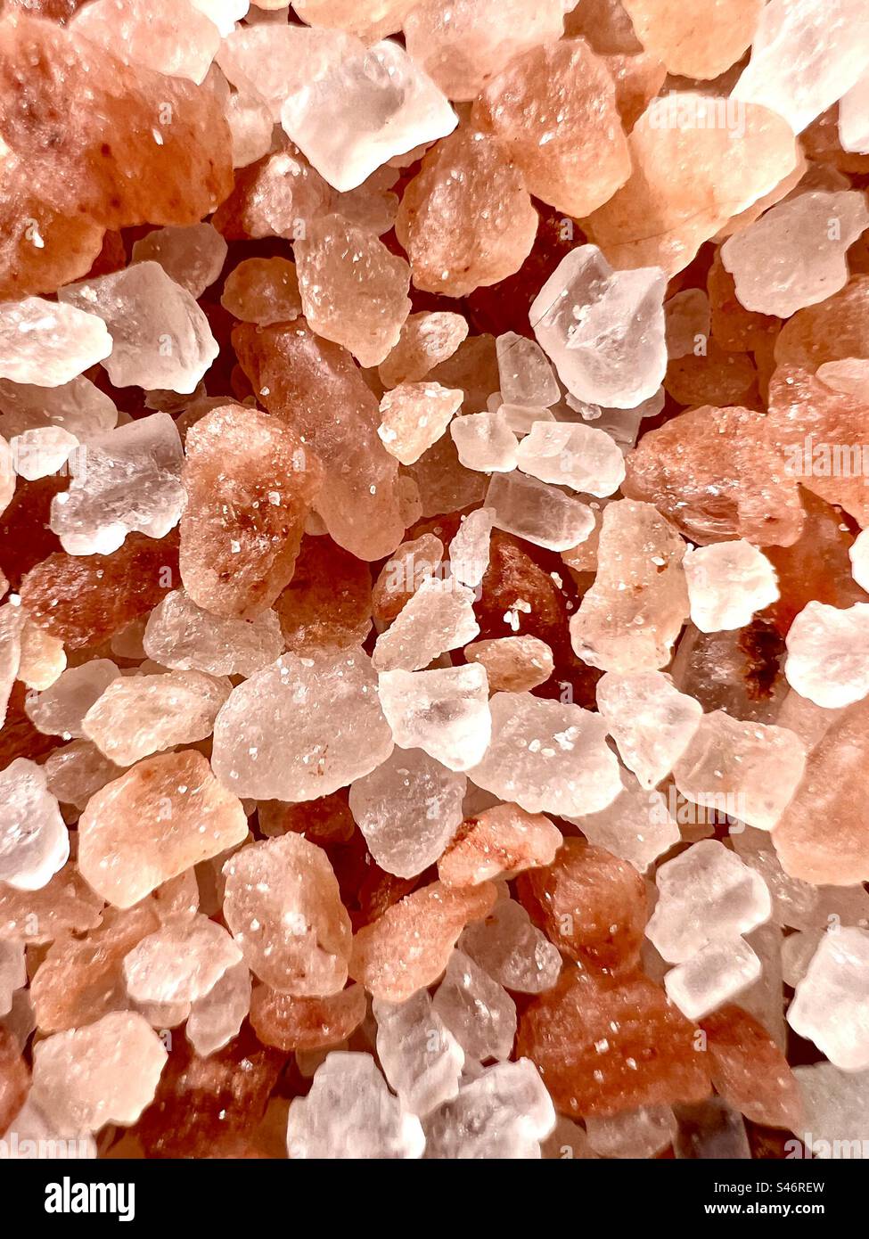 Vertical full frame of pink Himalayan salt crystals - Smartphone Captured Stock Image