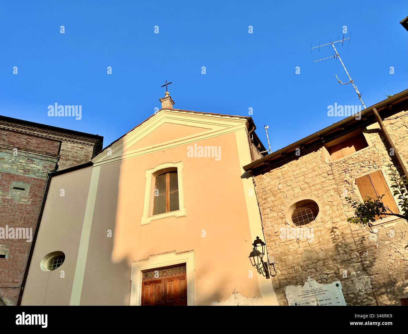 Church against the blue sky at Castello di Montegibbio in Sassuolo, Italy - Smartphone Captured Stock Image