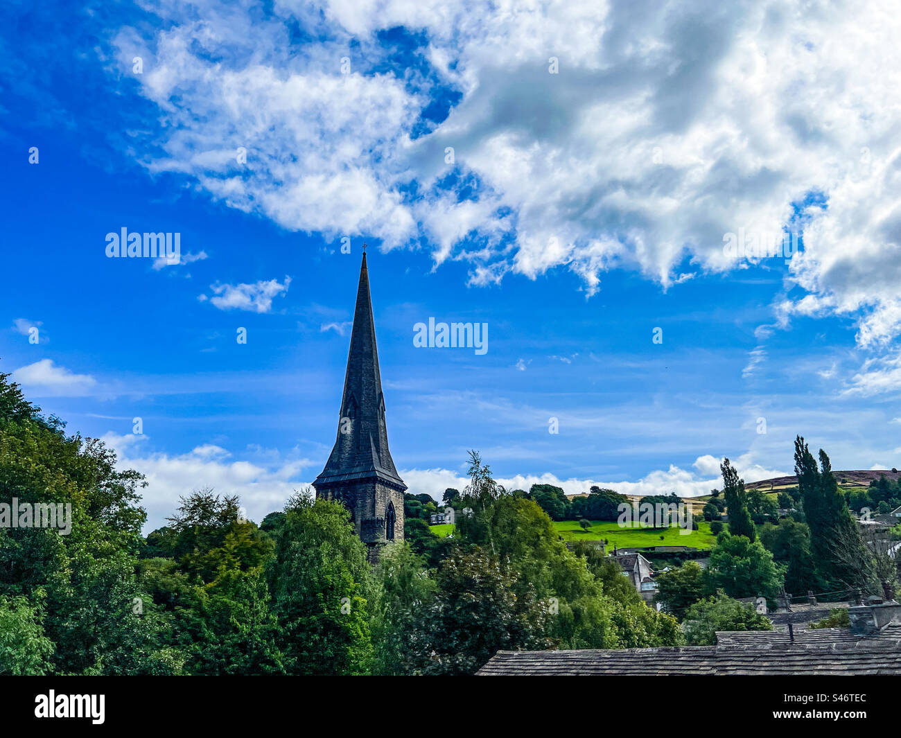 St Bartholomews church in the leafy Yorkshire village in West Yorkshire in the heart of the Pennines - Smartphone Captured Stock Image