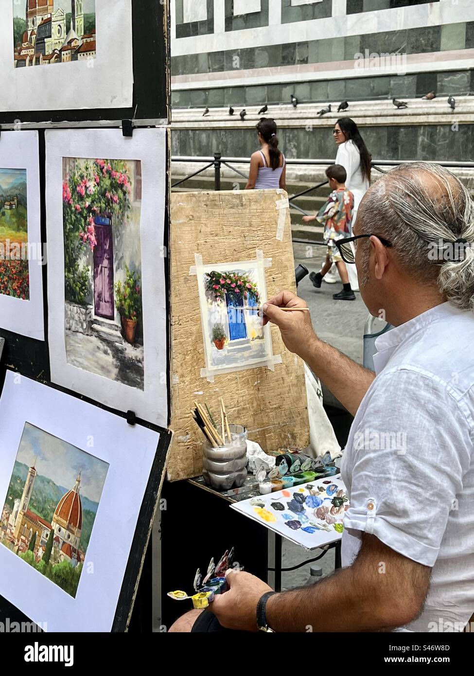 Artist painting in the Piazza Duomo in Florence, Italy. - Smartphone Captured Stock Image