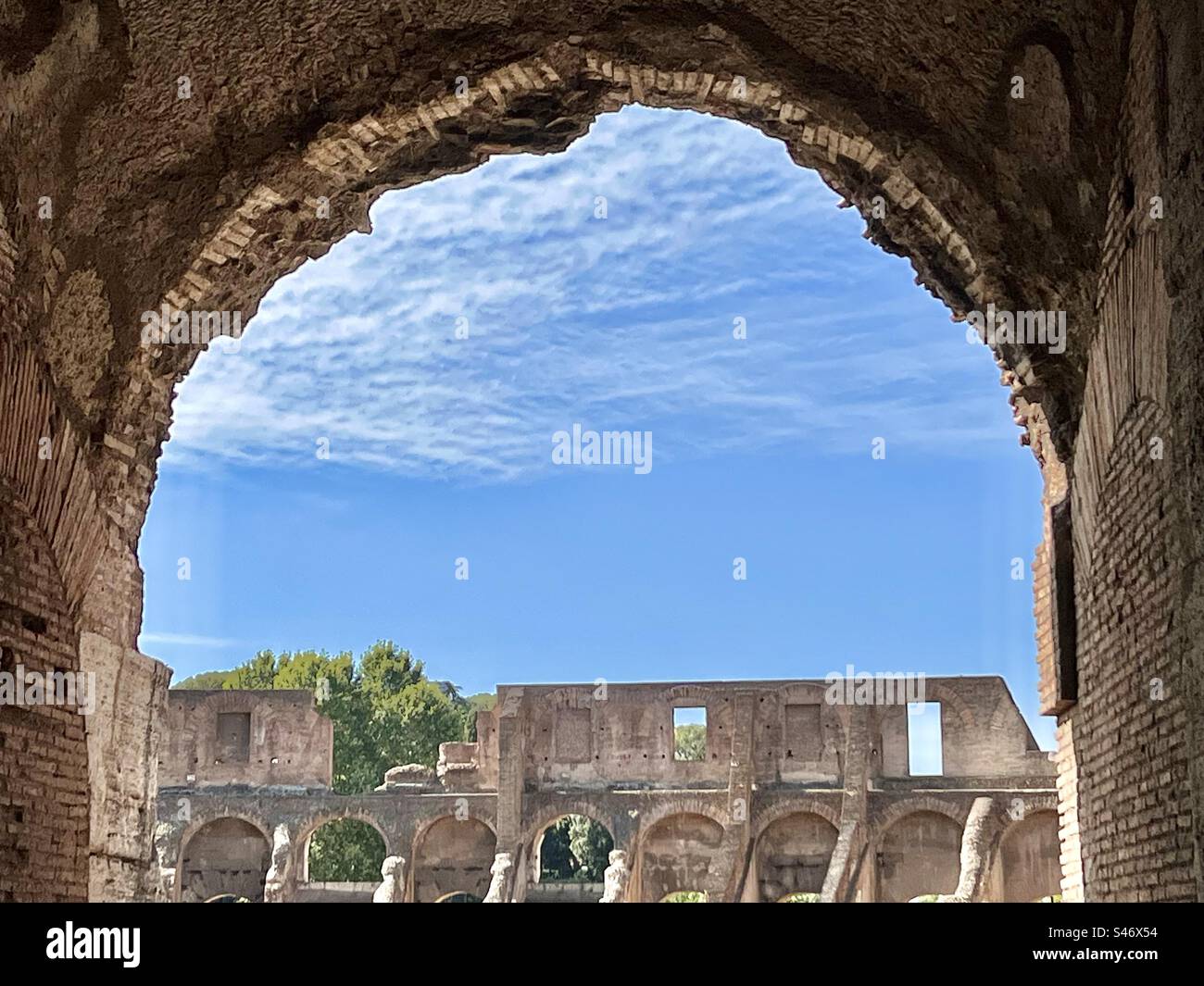 View from arch to arches in the Roman Colosseum on a summer day. - Smartphone Captured Stock Image
