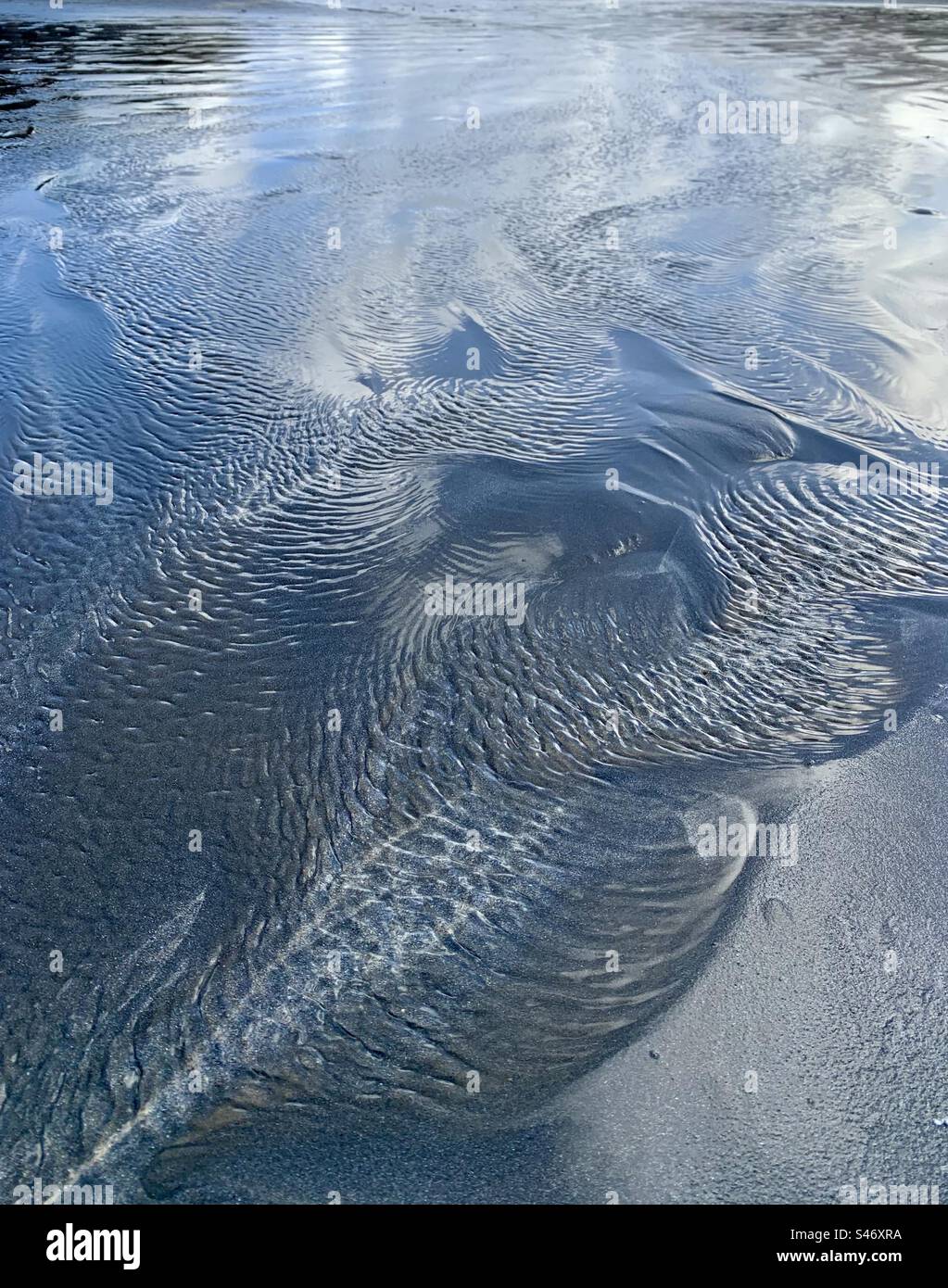 Patterns in water on beach - Smartphone Captured Stock Image