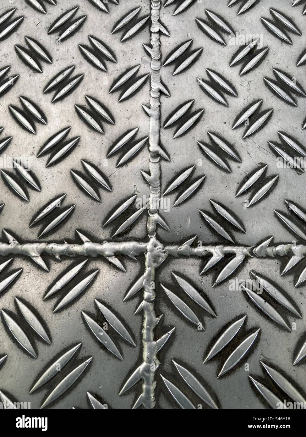 Stainless steel treads plates with pattern and seam - Smartphone Captured Stock Image