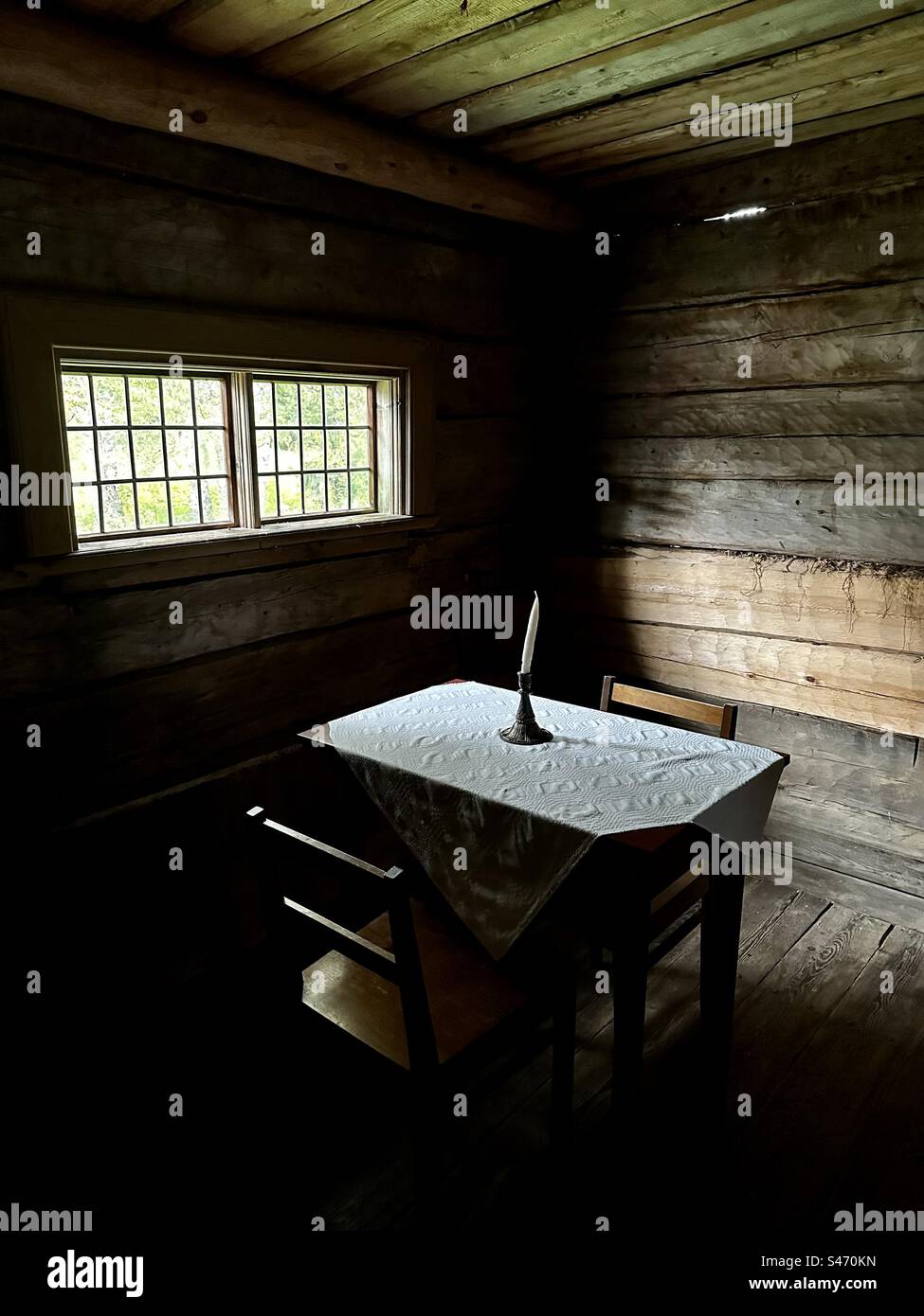 Dark old log house interior Stock Photo