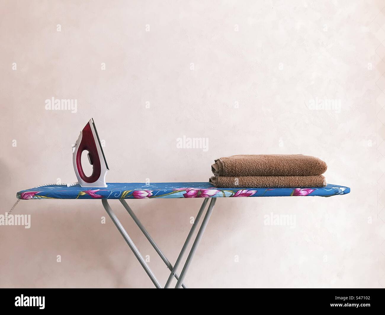Laundry ironing board in empty room - Smartphone Captured Stock Image