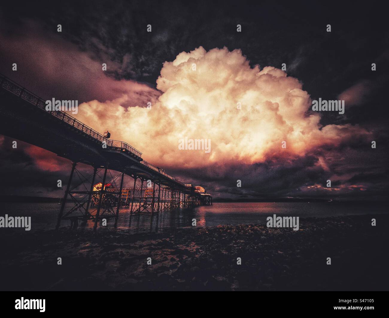 Atmospheric moody cloudy sky over mumbles pier, in Swansea, south wales, UK. Summer 2023. - Smartphone Captured Stock Image