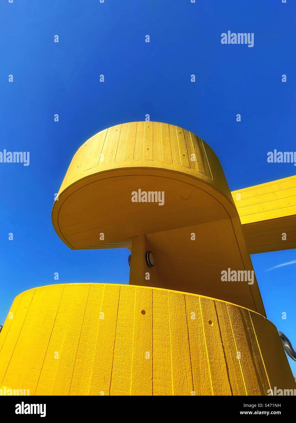 Yellow spiral staircase against a vivid blue sky, Festival Hall on London South Bank Stock Photo