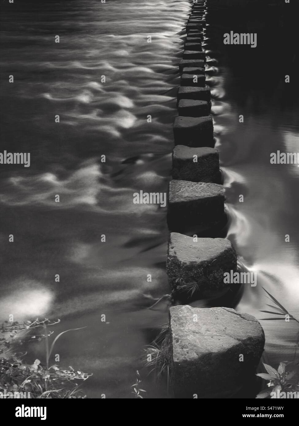 Stepping stones across a river - Smartphone Captured Stock Image