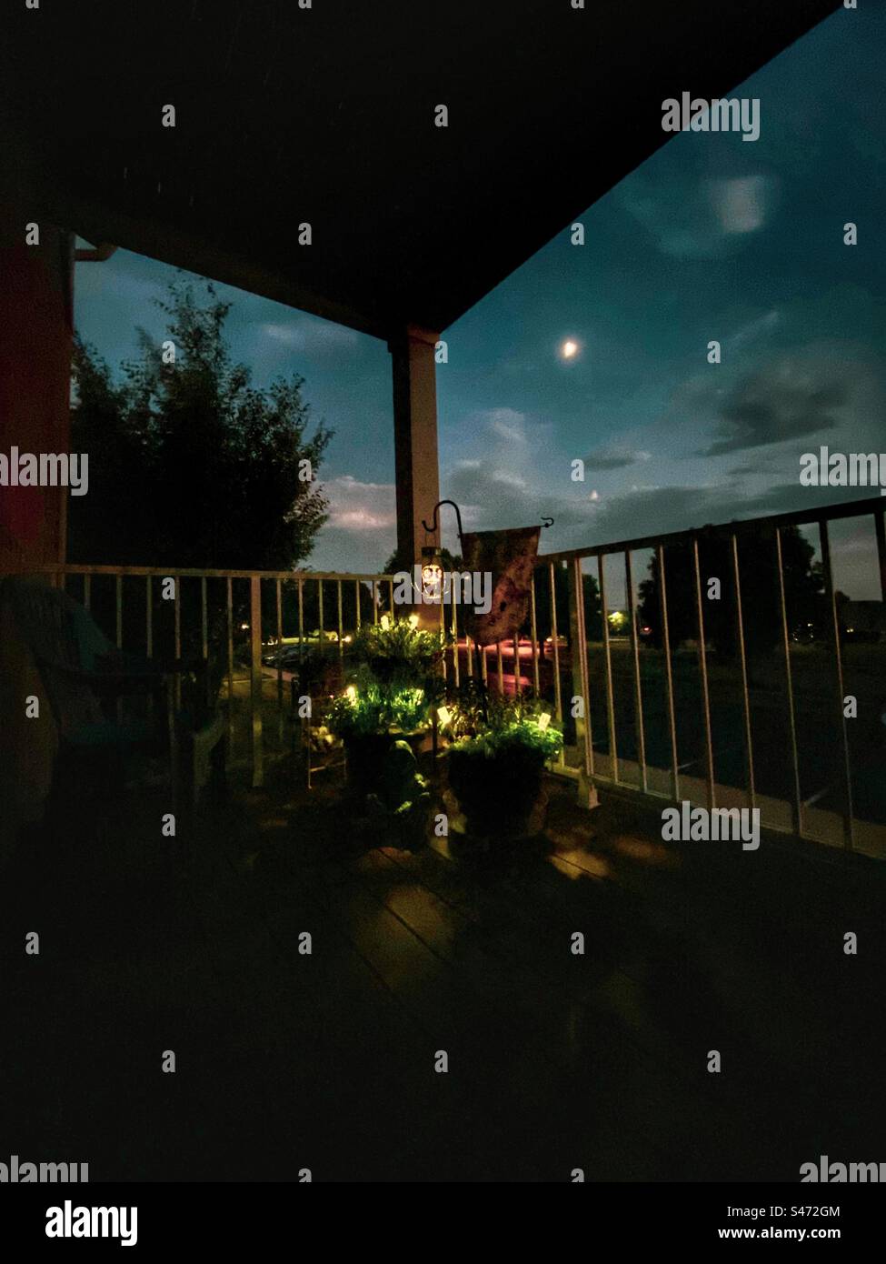A moonlit evening in a balcony garden. - Smartphone Captured Stock Image