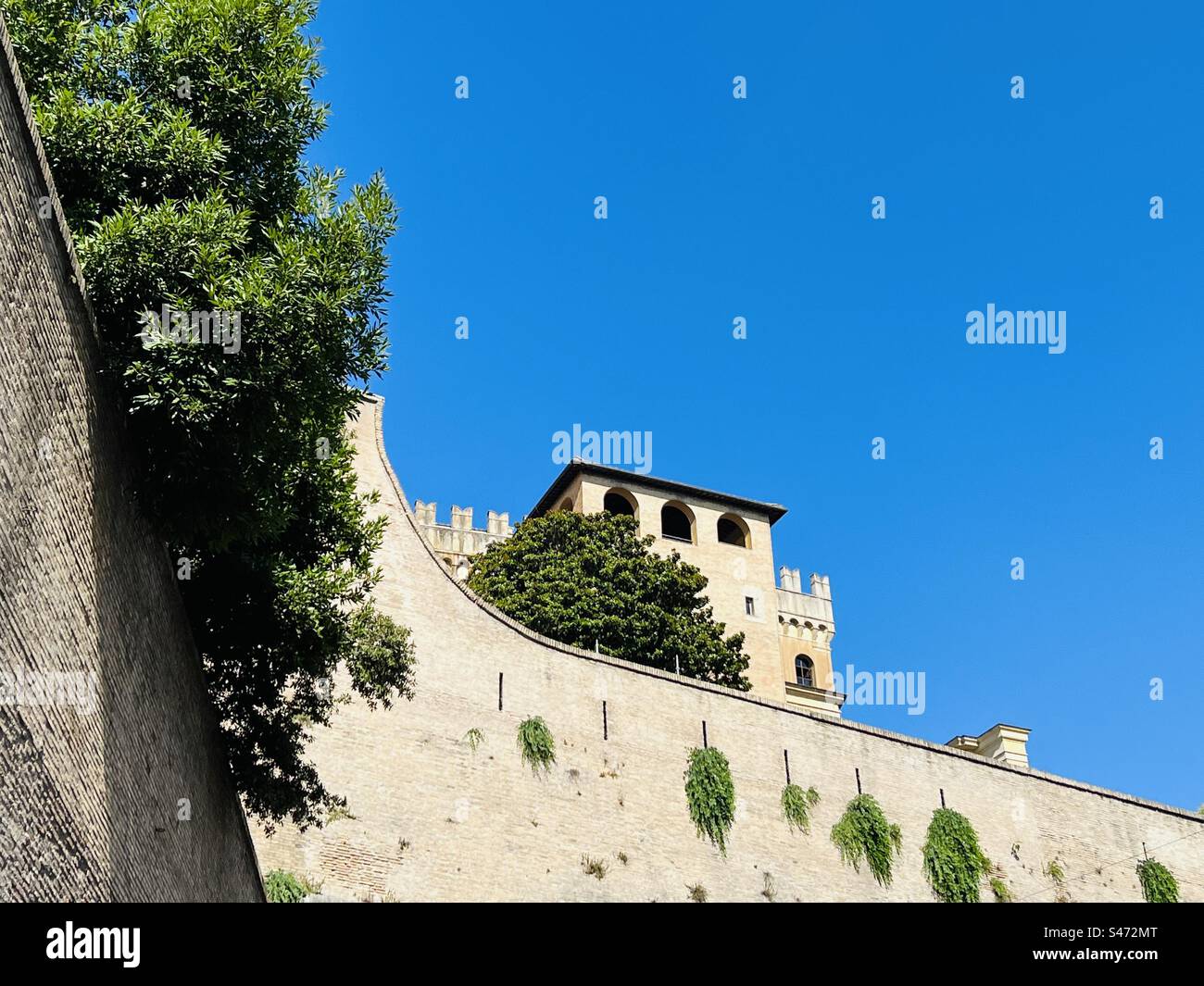 Vatican City wall and Vatican Museum seen from Viale dei Bastioni di Michelangelo street in Rome, Italy. - Smartphone Captured Stock Image