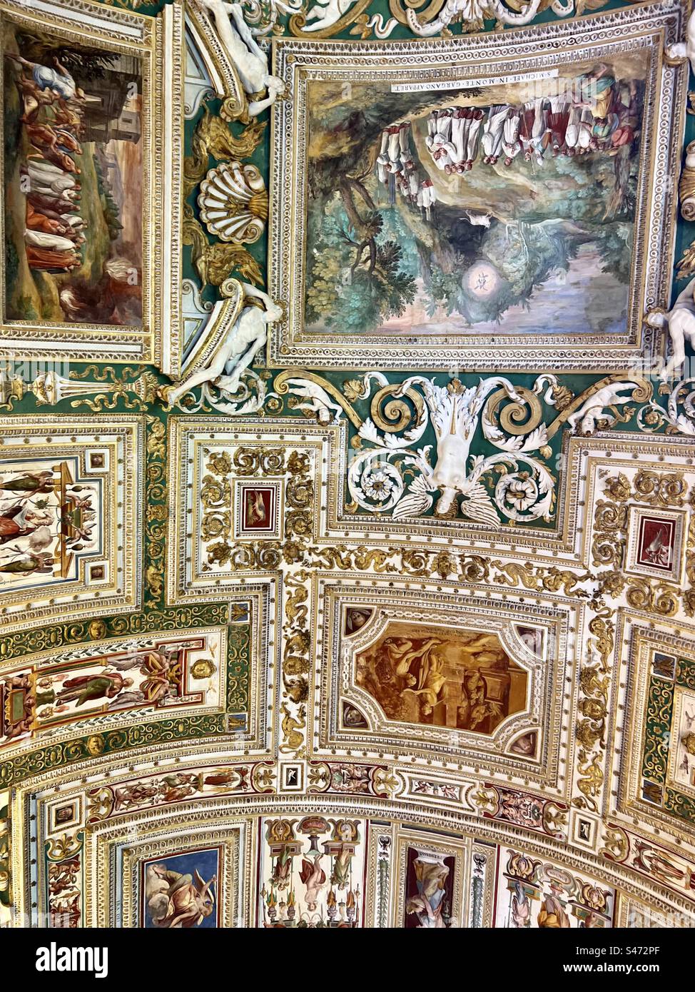 Part of the large ornate arched ceiling in the gallery of maps in the Vatican museum - Smartphone Captured Stock Image