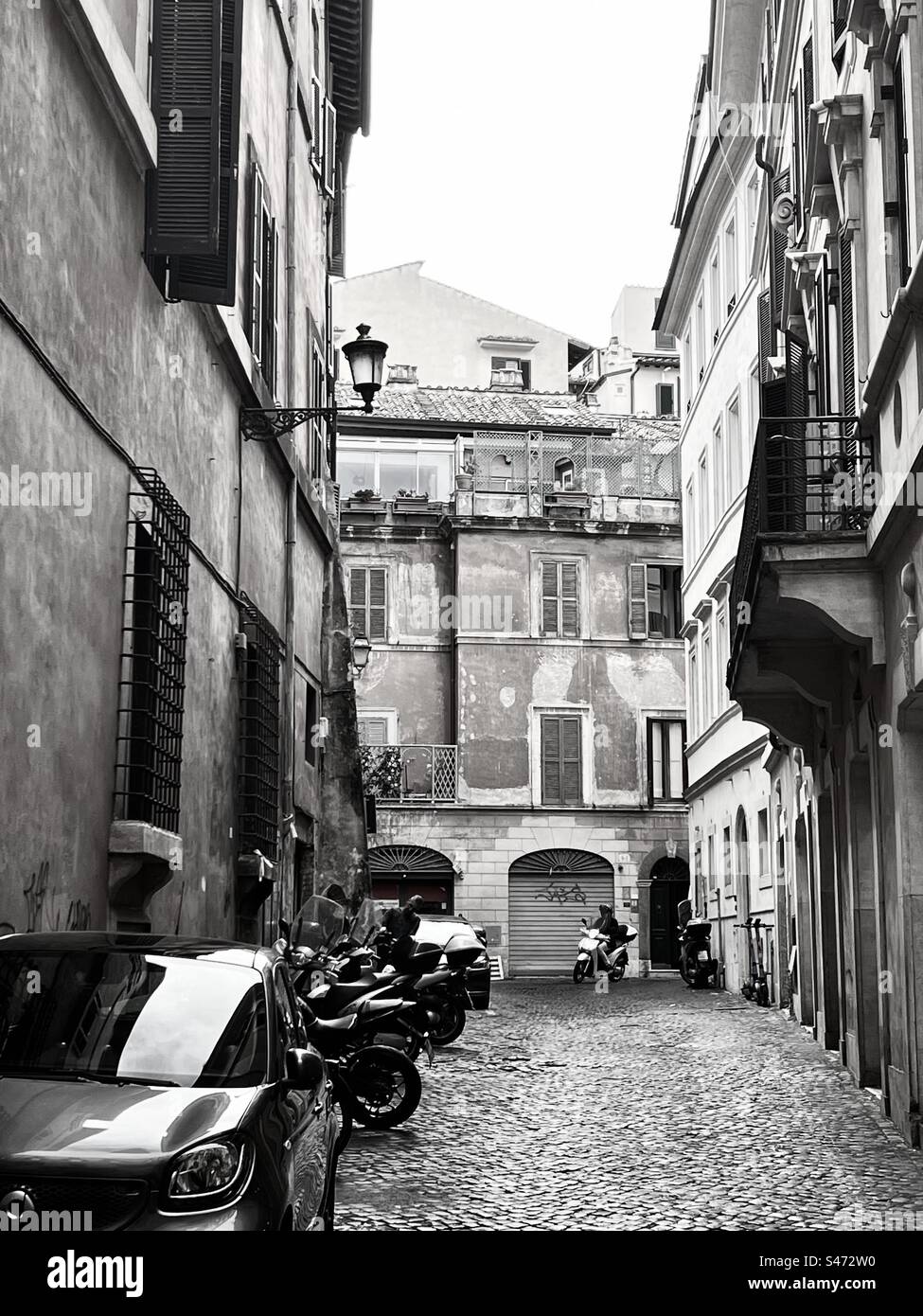 Black and white of Vicolo Della Torretta street in Rome Italy - Smartphone Captured Stock Image