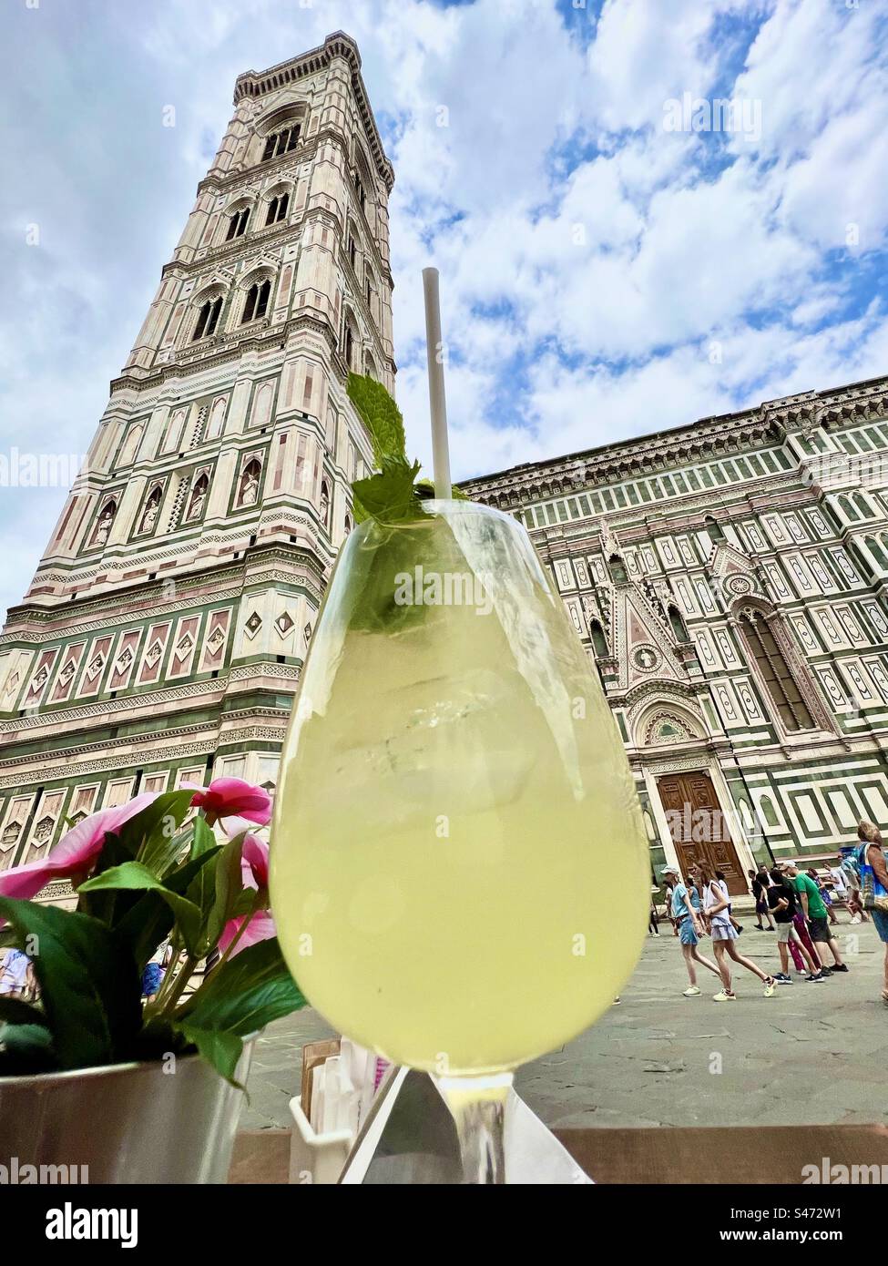 Limoncello spritz drink enjoyed in the Piazza del Duomo in front of the famous Cathedral of Santa Maria del Fiore in Florence, Itraly. - Smartphone Captured Stock Image