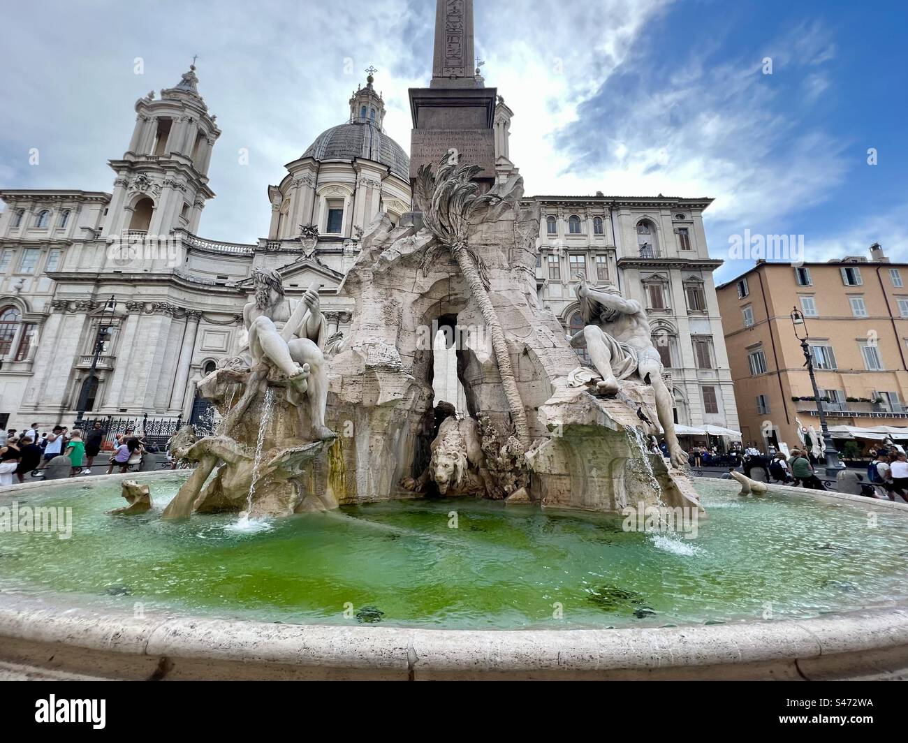 Beautiful fountain in Rome’s Piazza Navona, Fontana dei Quattro Fiumi surrounded by lovely architecture - Smartphone Captured Stock Image