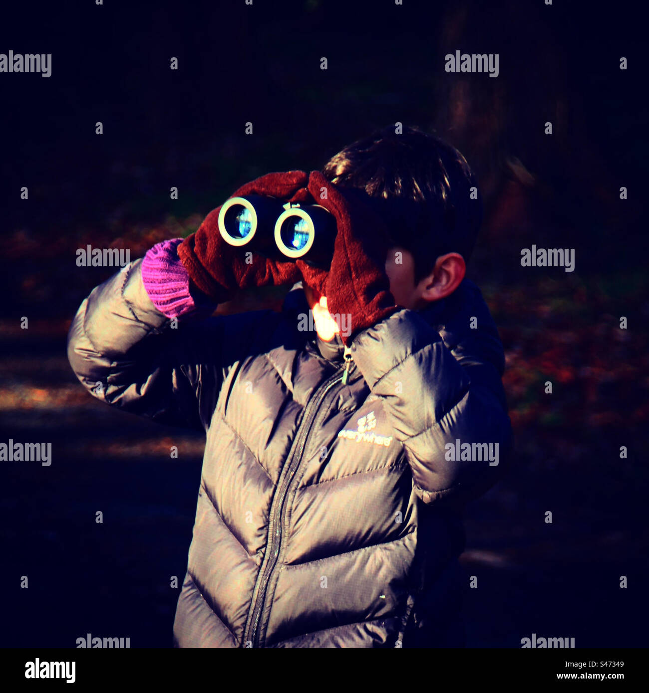 little spy with binocular Stock Photo - Alamy