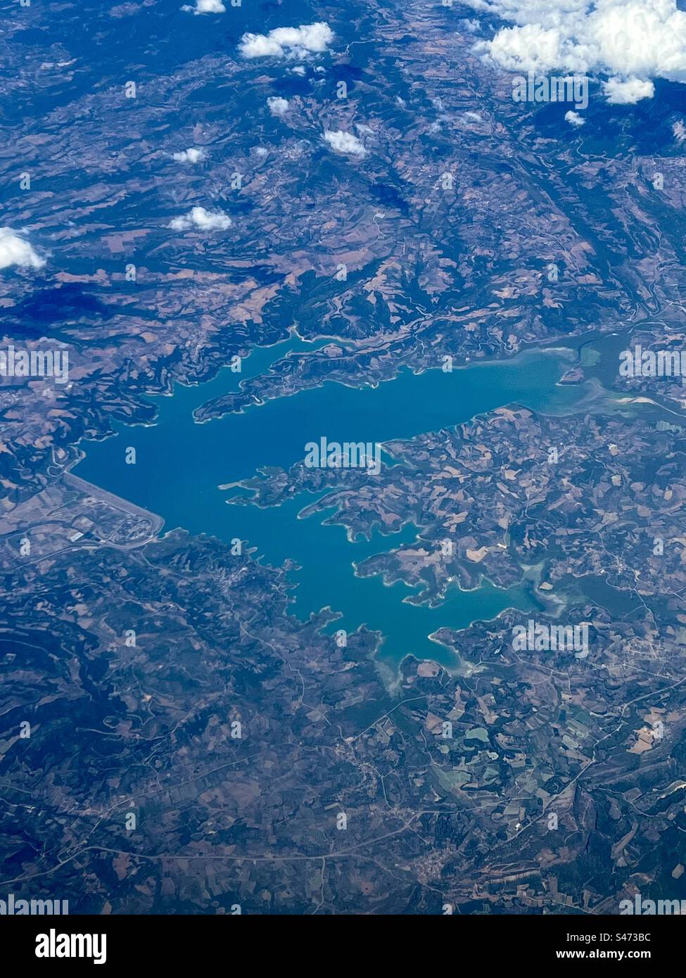 Aerial view over Pelopnnese, Greece with the artificial lake of Pinios - Smartphone Captured Stock Image