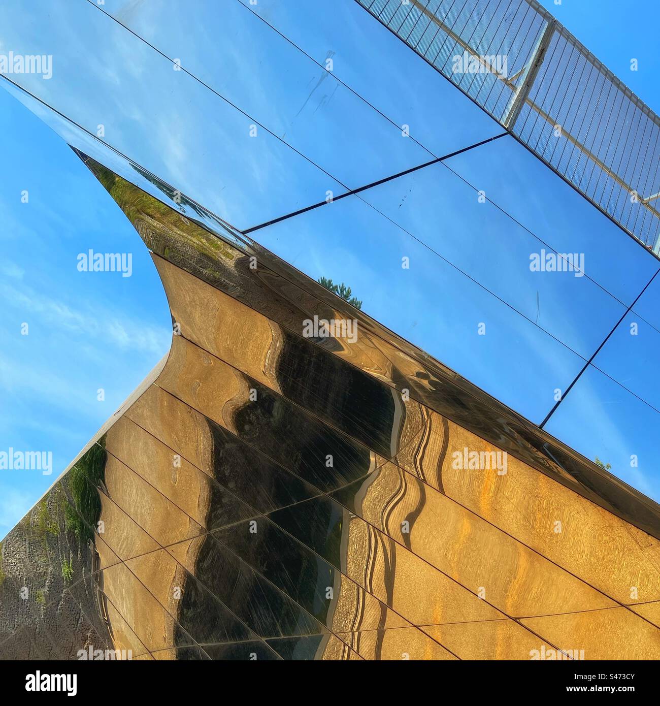 Reflections in mirror covered bridge over river Lea at Queen Elizabeth Olympic Park, Stratford in London - Smartphone Captured Stock Image