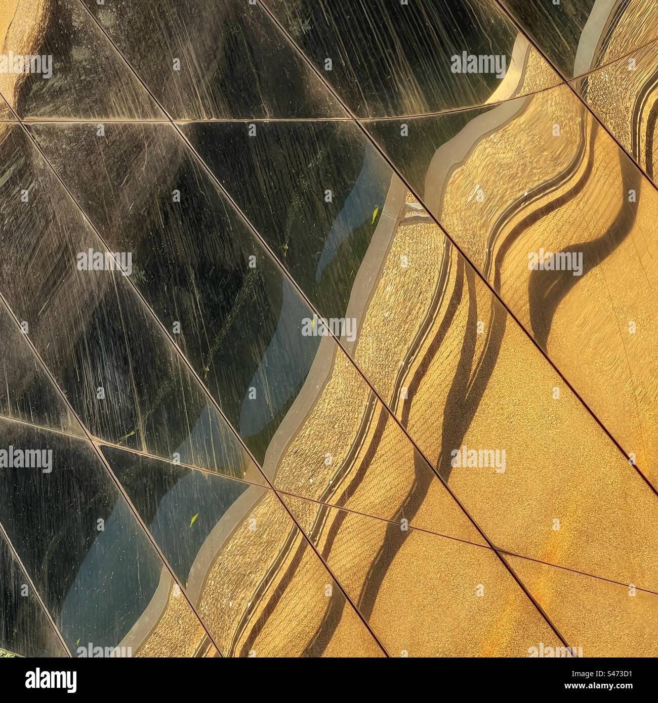 Reflections in mirror covered bridge over river Lea at Queen Elizabeth Olympic Park, Stratford in London - Smartphone Captured Stock Image