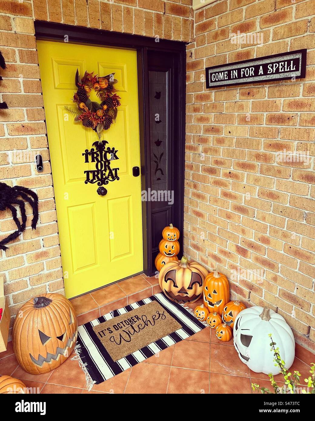A front door decorated for Halloween Stock Photo