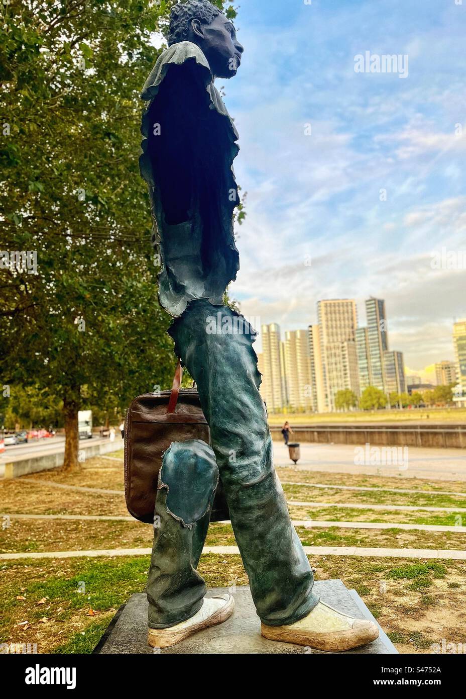 KHADINE is a sculpture by Bruno Catalano on the banks of the River Thames in London. It symbolises moving or travelling people. September 2023 opposite Tate Art Gallery. - Smartphone Captured Stock Image