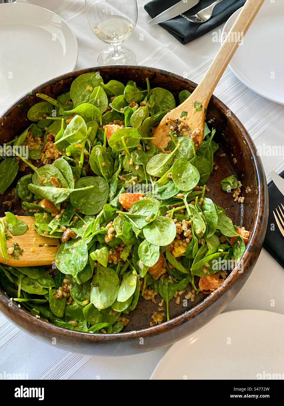 Fresh baby spinach salad with walnuts and oranges. - Smartphone Captured Stock Image