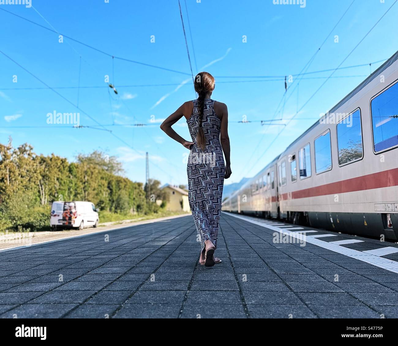 Young woman at the railway station - Smartphone Captured Stock Image