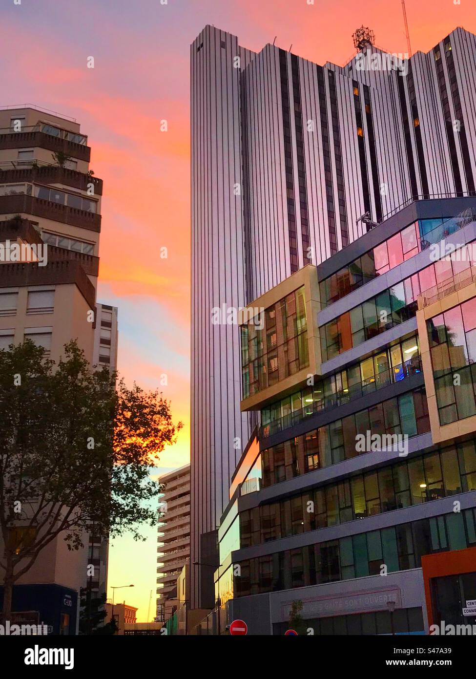 Commercial buildings in Paris lit up by beautiful evening light - Smartphone Captured Stock Image