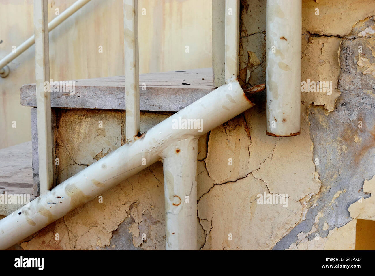 Yellow architectural details in bad condition Stock Photo
