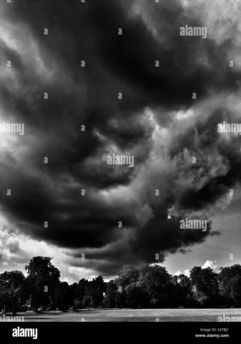 Dramatic clouds over a London park - Smartphone Captured Stock Image Dramatic clouds over a London park - Smartphone Captured Stock Image