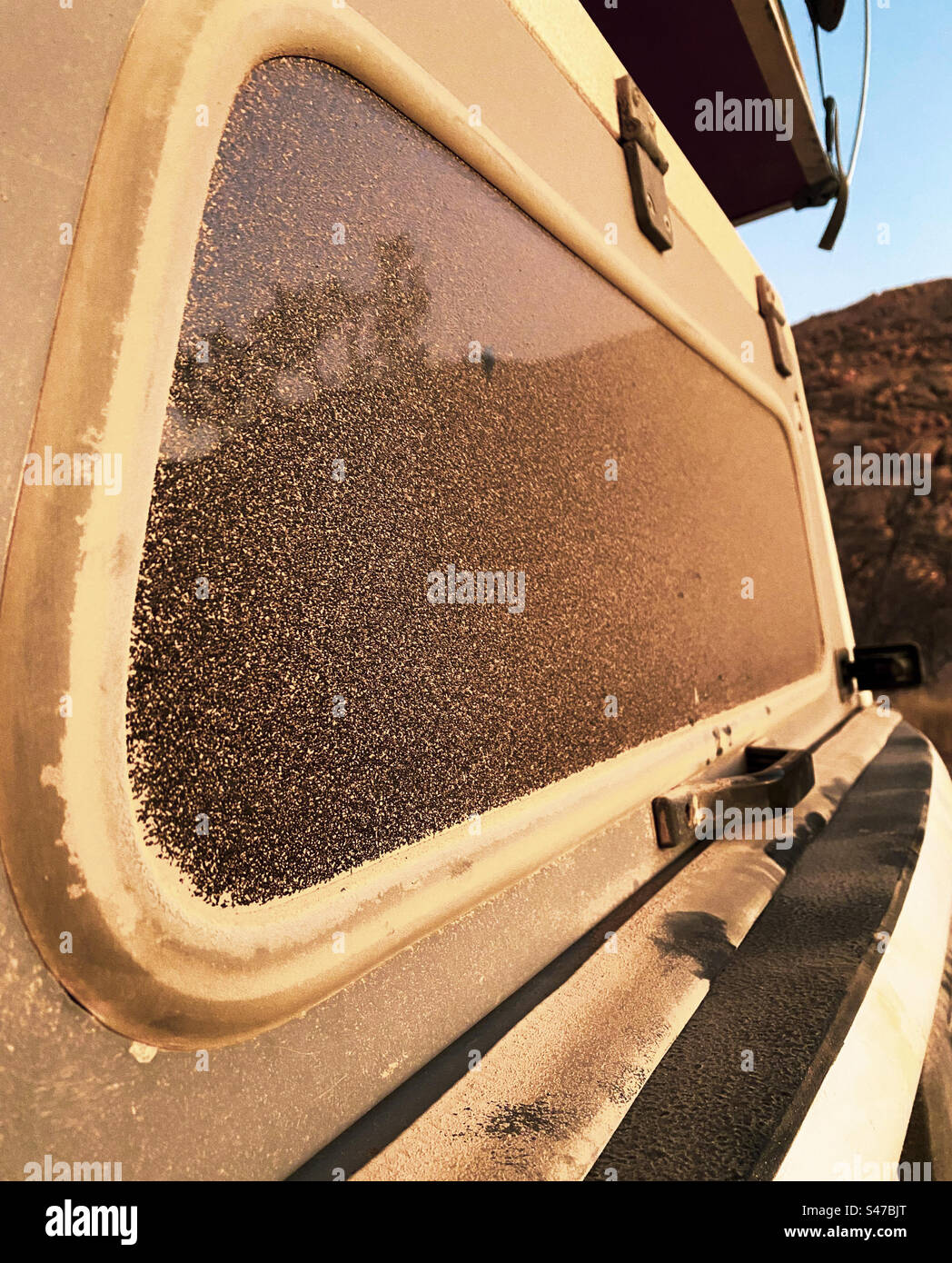 Dust on the back of a vehicle after driving on gravel roads in Namibia - Smartphone Captured Stock Image