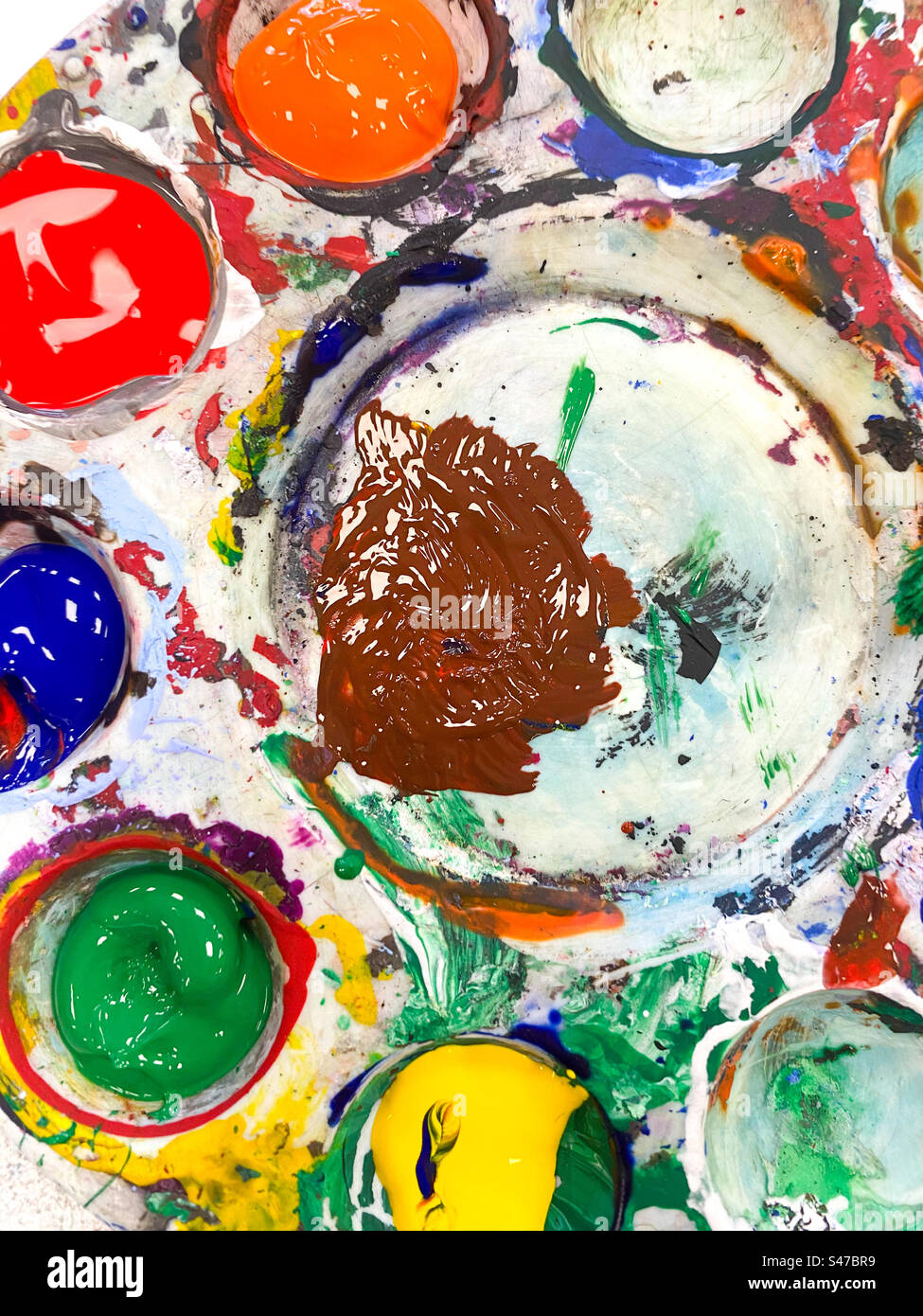 A artist’s palette with different coloured paints. - Smartphone Captured Stock Image