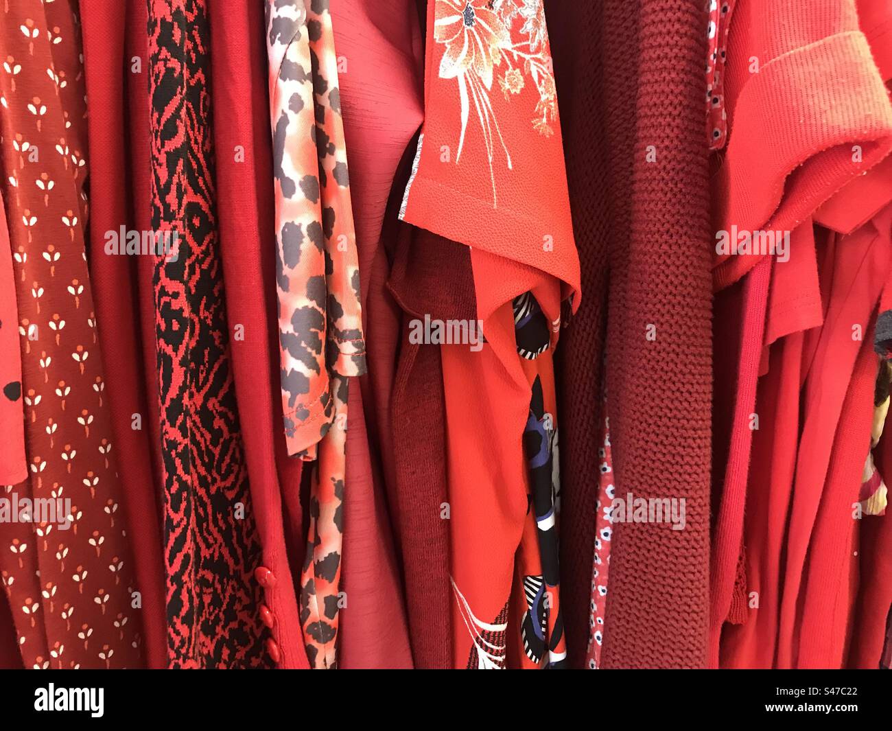 Dresses in charity shop - Smartphone Captured Stock Image
