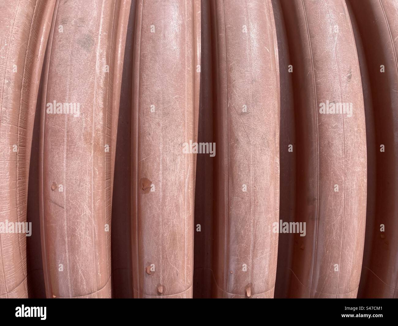 Vertical groove pattern on a barrel in a pink color - Smartphone Captured Stock Image