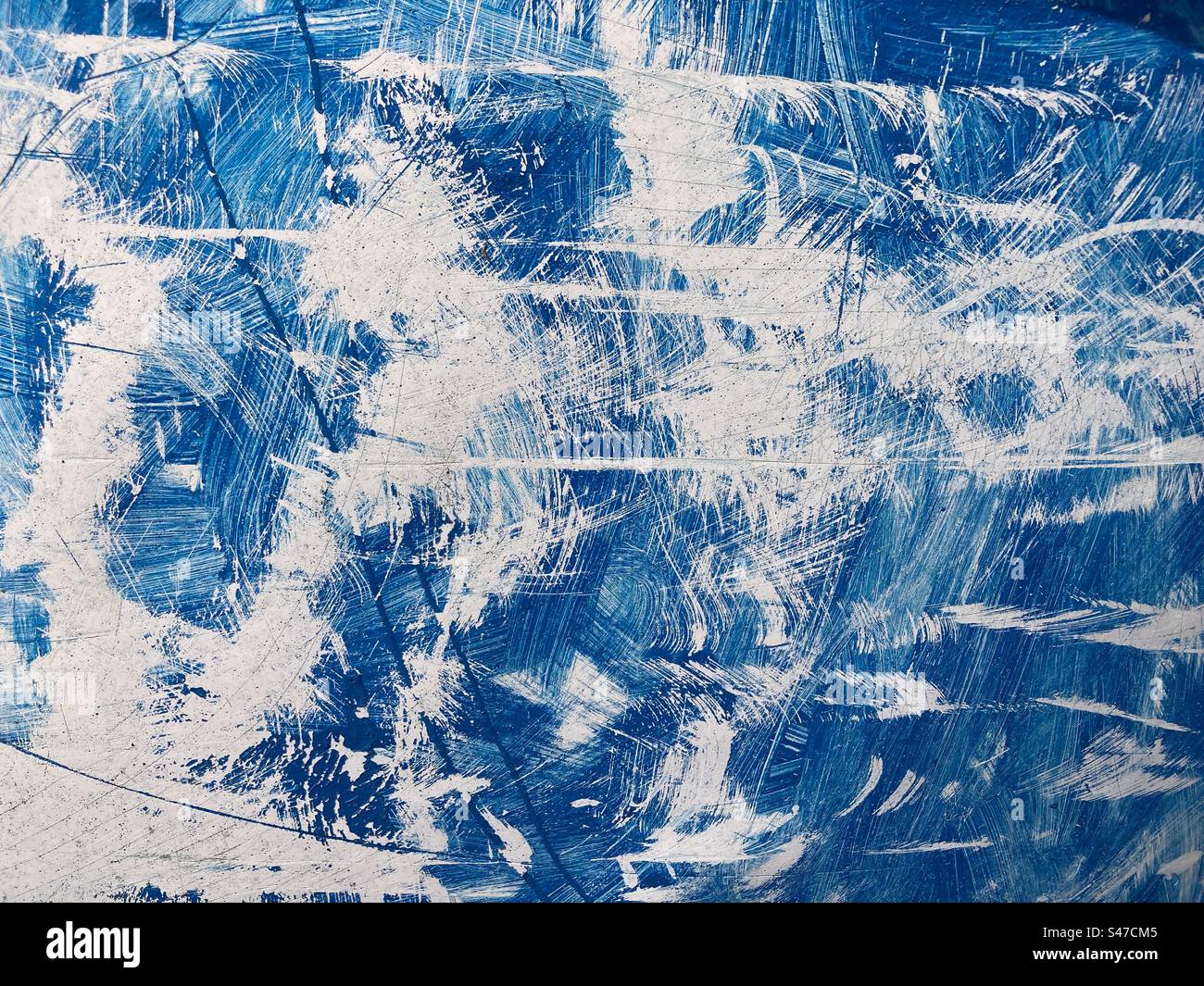 Bright white scratches on a blue surface - Smartphone Captured Stock Image