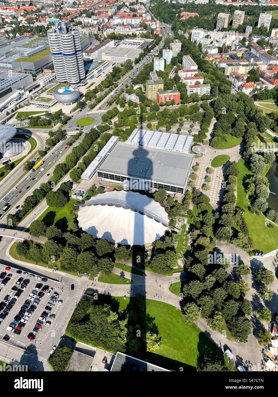 Munich cityscape as seen from Olympiaturm tower, large tower shadow in the middle of the picture Stock Photo