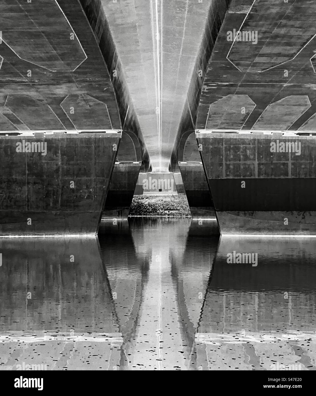 Reflections under the bridge downtown. - Smartphone Captured Stock Image