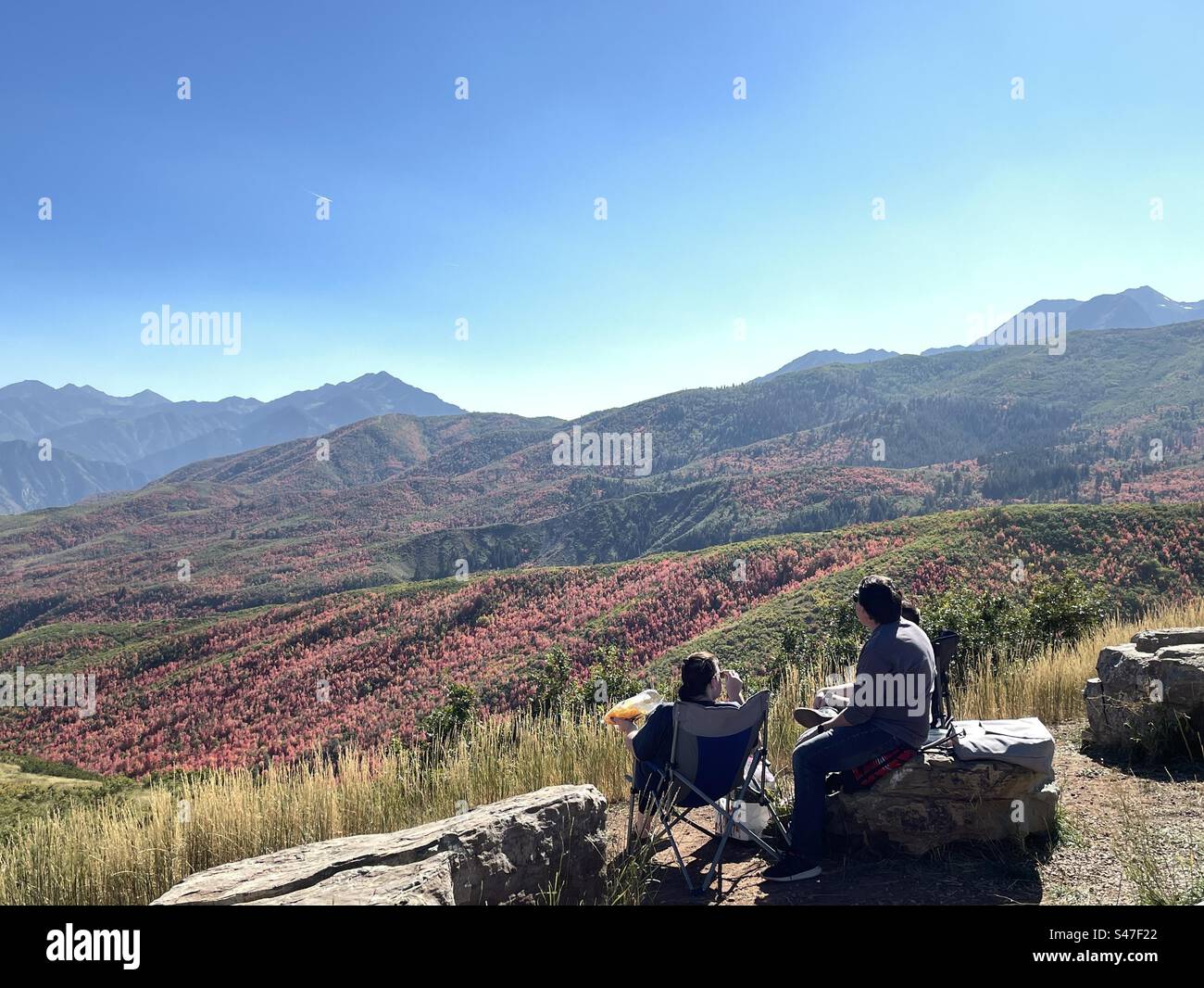 People enjoying an impromptu picnic on a beautiful fall day in the Utah mountains. - Smartphone Captured Stock Image