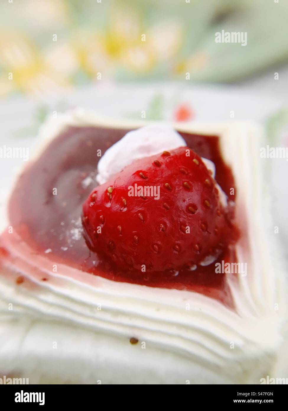 A close up of a red strawberry pastry - Smartphone Captured Stock Image