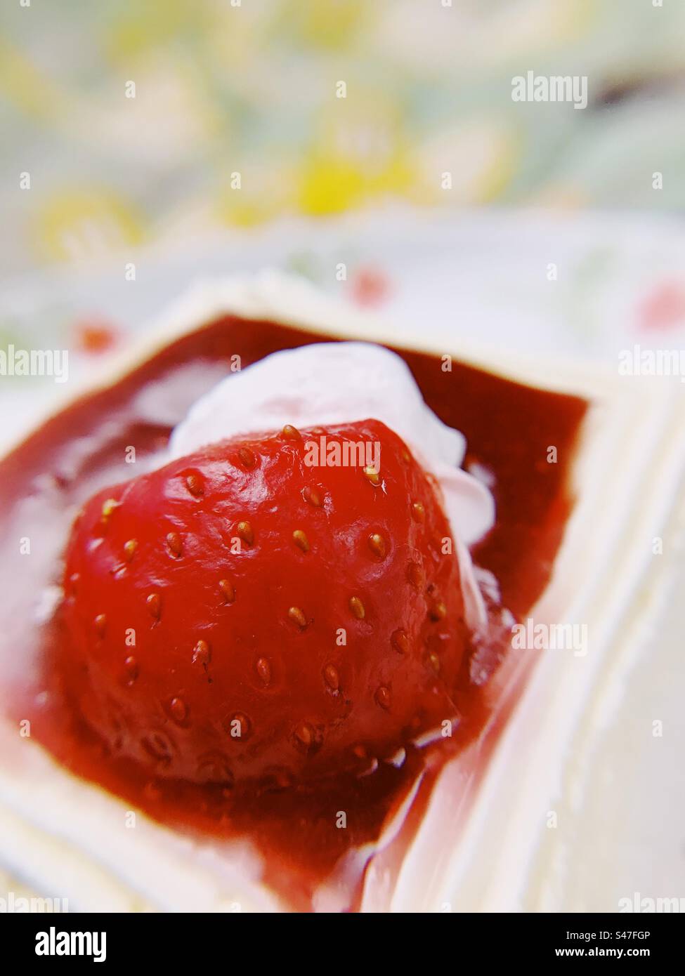 A close up of a red strawberry pastry - Smartphone Captured Stock Image