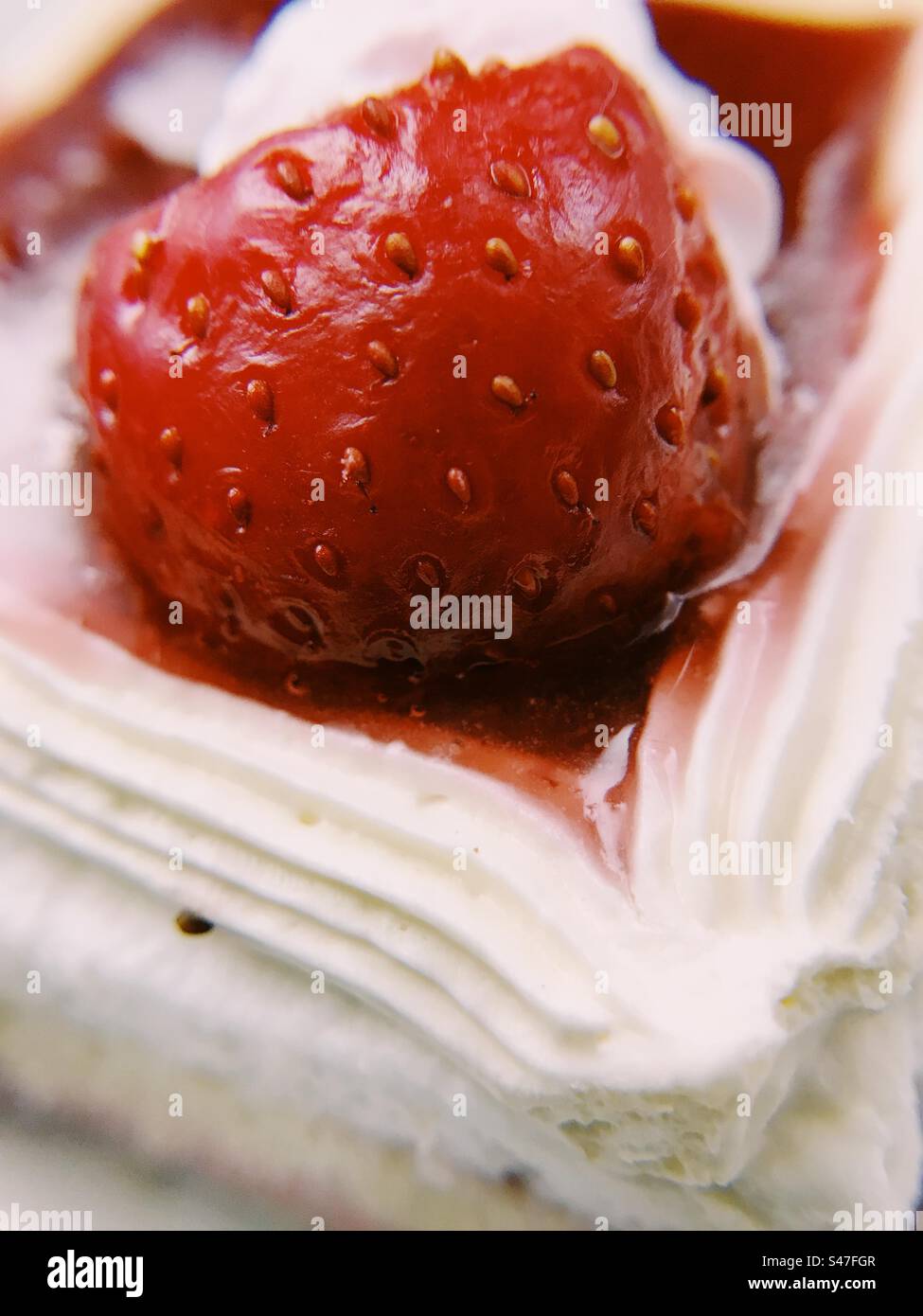 A close up of a red strawberry pastry - Smartphone Captured Stock Image