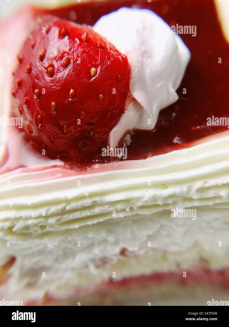 A close up of a red strawberry pastry - Smartphone Captured Stock Image