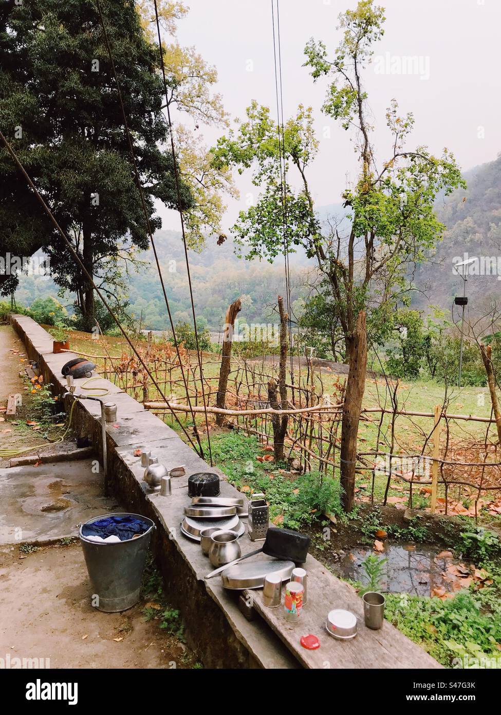 Utensils kept for washing in an outdoor area in a park - Smartphone Captured Stock Image