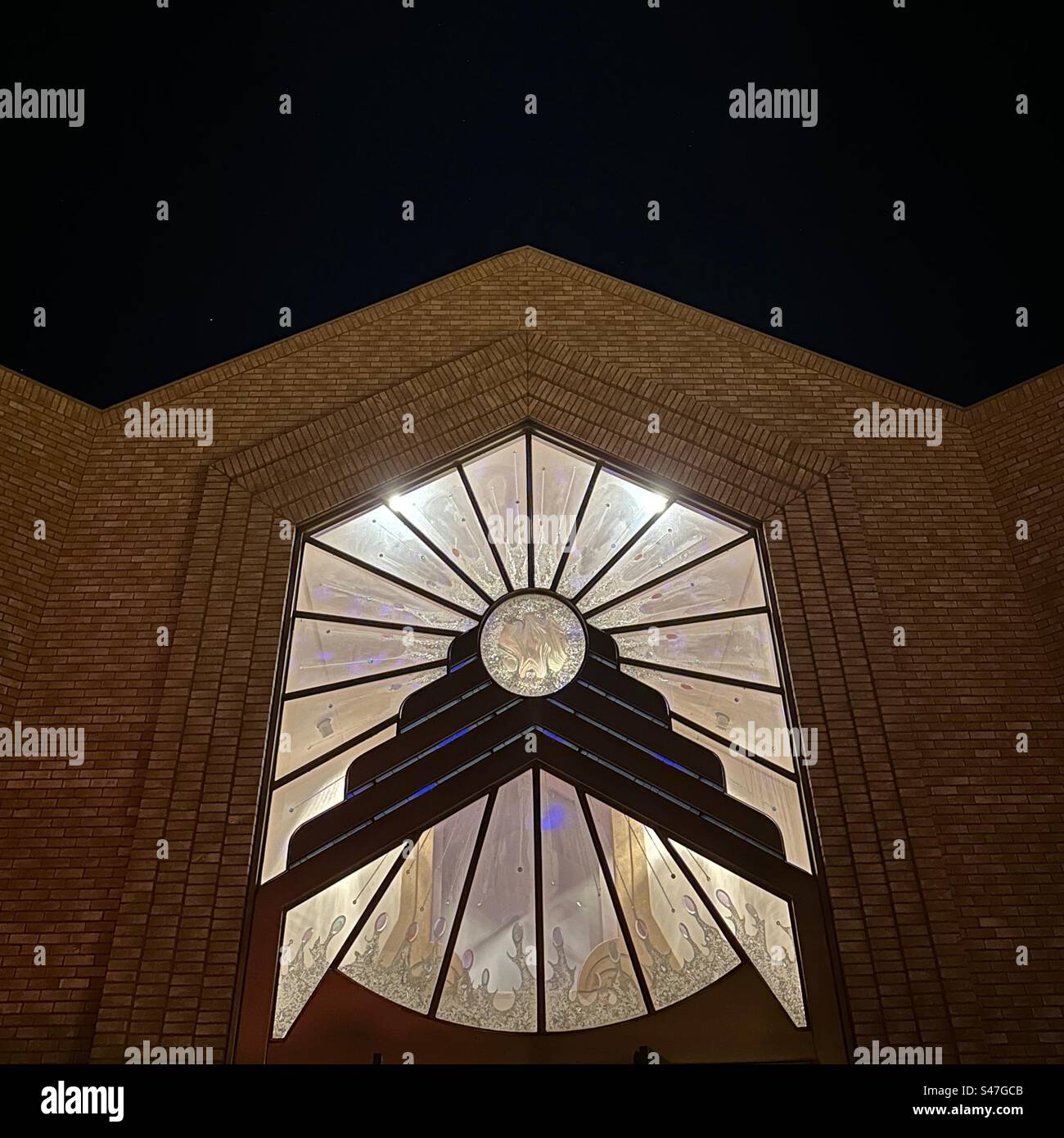 Night view of church window at Unity Church in Boulder, Colorado, USA. - Smartphone Captured Stock Image