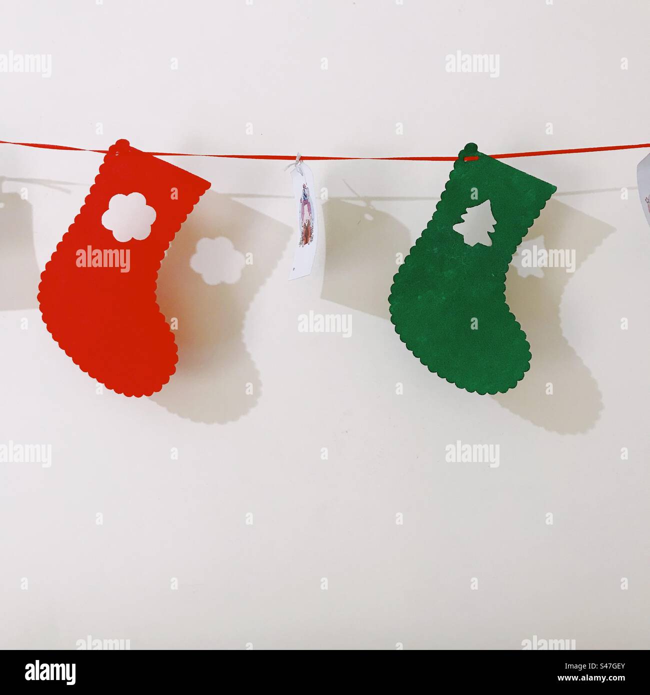 Christmas stocking decorations hanging on the wall Stock Photo