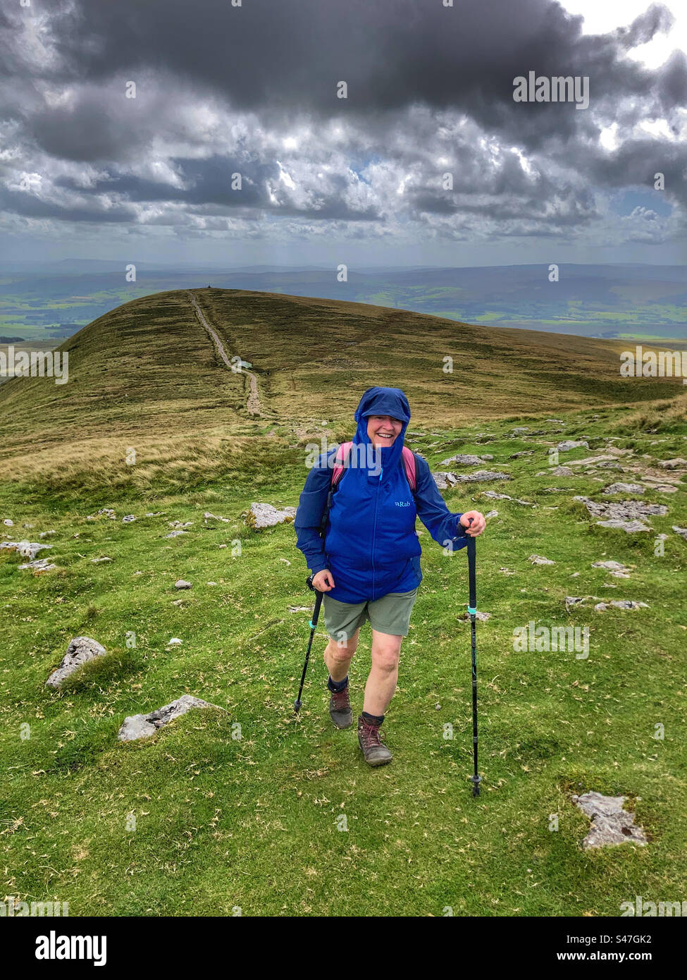 Woman walking up Ingleborough Yorkshire Dales - Smartphone Captured Stock Image