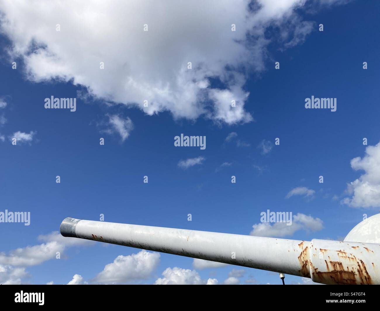 Gun barrel of warship against blue sky - Smartphone Captured Stock Image